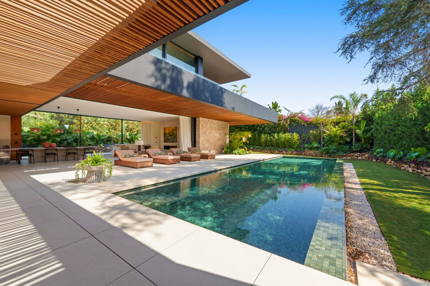 South-facing villa on a quiet plinth above the town, read with an architect's eye